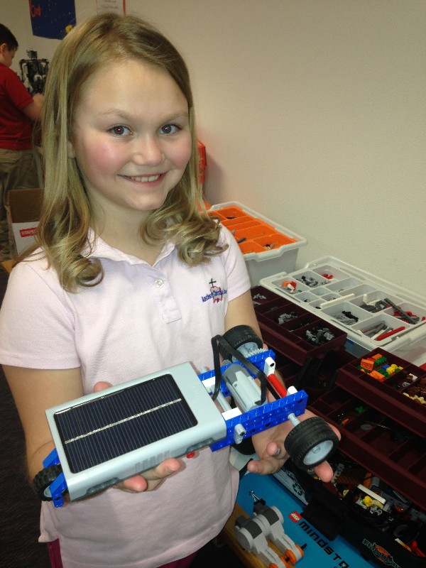 A student at Anchorage Christian School poses with her solar energy LEGO project in May, purchased with a grant from the chapter in partnership with its corporate sponsors.